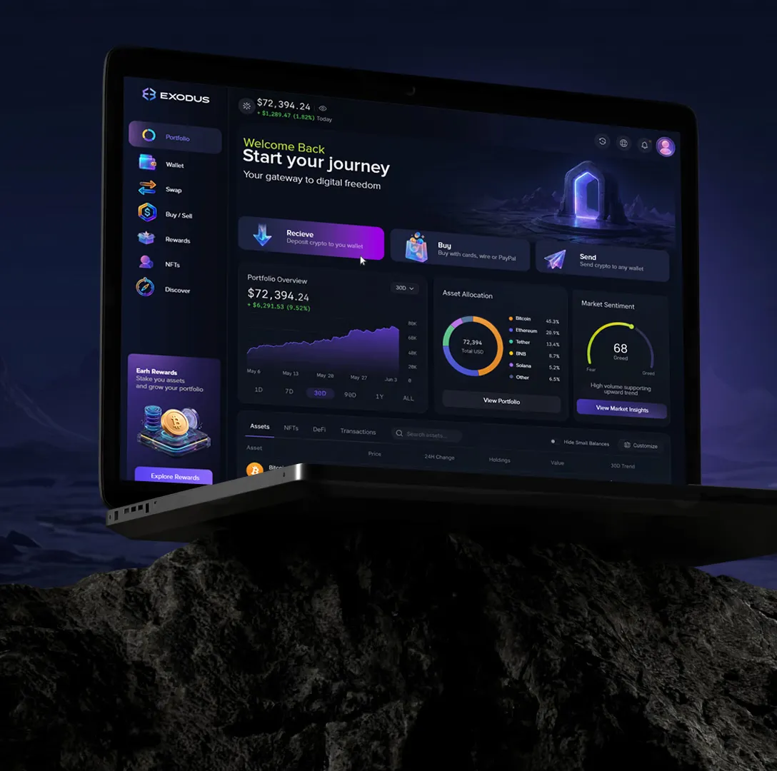 Exodus wallet dashboard shown on a laptop resting on dark rock.